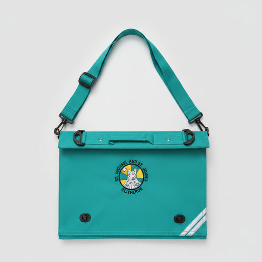 A turquoise canvas utility bag with a matching shoulder strap, featuring a circular embroidered crest for St. Michael and St John Primary School in Clitheroe